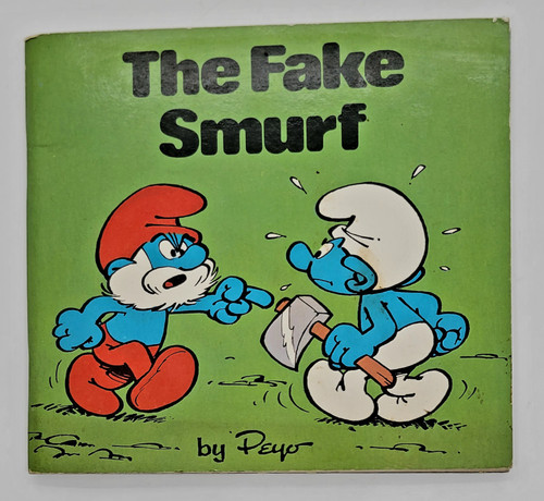 Peyo The Fake Smurf by Peyo - Paperback (1981), colorful cover illustration of a Blue Smurf and a Grumpy Smurf arguing, with a green background.