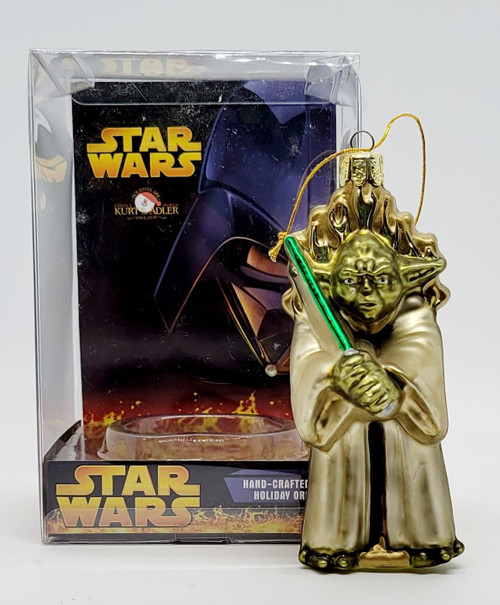 Kurt Adler 2005 Star Wars Yoda Hand-Crafted Glass Holiday Ornament, gold-colored Yoda figure holding a green lightsaber with a detailed facial expression and intricate hair design.