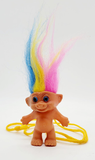 Unknown Vintage 2-inch Troll Doll with Rainbow Hair Necklace, made in Korea, featuring a small tan plastic troll doll with large blue eyes and colorful pink, yellow, and blue hair.