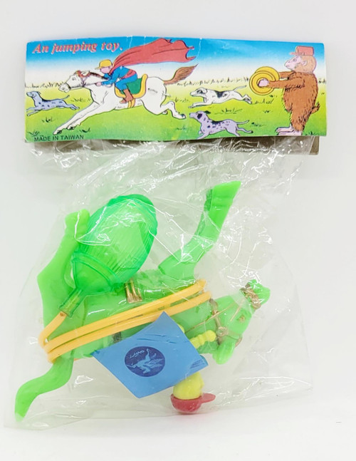 Unbranded Vintage A Jumping Toy Horse With Rider Made in Taiwan, green plastic toy horse with rider, packaged in clear plastic bag with colorful illustrated cardboard header featuring children riding a horse and animals in a field.