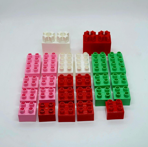 MEGA BLOKS Mattel MEGA BLOKS Lot of 25 Blocks, colorful plastic building blocks in pink, white, red, and green, arranged on a white background.