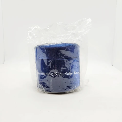 AVON Shimmering Keep Sake Box Blue Embroidered, blue embroidered keepsake box wrapped in plastic packaging.