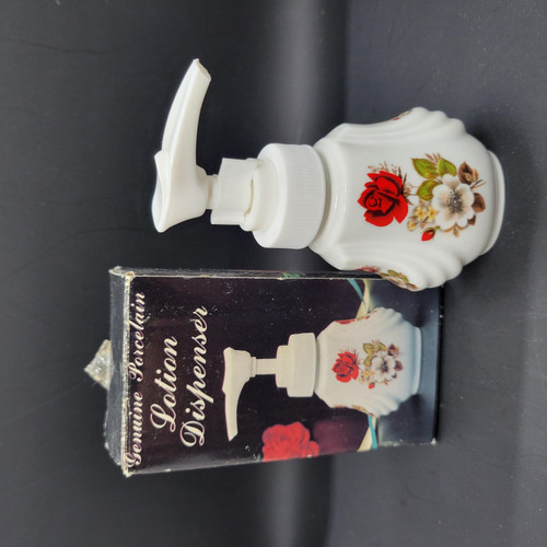 Unknown Vintage Floral Genuine Porcelain Lotion Dispenser, white ceramic dispenser with a floral pattern of red, white, and brown flowers.