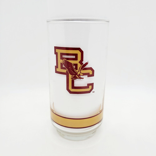 Getty NCAA Big East Basketball Glass Tumbler, vintage Boston College collectible, 5.5 inches tall, clear glass with red and yellow College logo and gold stripe at the base.
