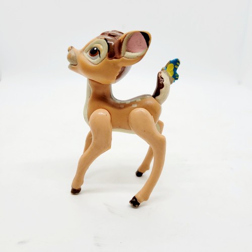 McDonald's Happy Meal toy figure of Bambi with butterfly on tail from the 1988 Disney Classic Bambi series.  The figure has legs that move forward and backwards.  Bambi's head moves side to side and stands 3-inches tall. McDonald's Happy Meal toy figure of Bambi with butterfly on tail from the 1988 Disney Classic Bambi series.  The figure has legs that move forward and backwards.  Bambi's head moves side to side and stands 3-inches tall.