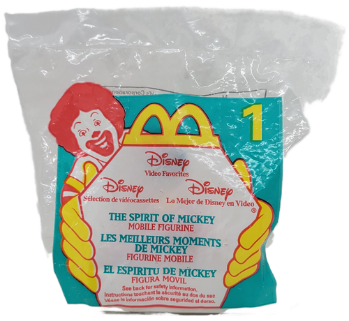 McDonald's Happy Meal Toy of The Spirit of Mickey from the 1998 Disney Video Favorites series of toys. The toy features Bandleader Mickey from The Spirit of Mickey standing on top of The Spirit of Mickey VHS tape. The series contains 6 different toys and was available September 11 - October 1, 1998.