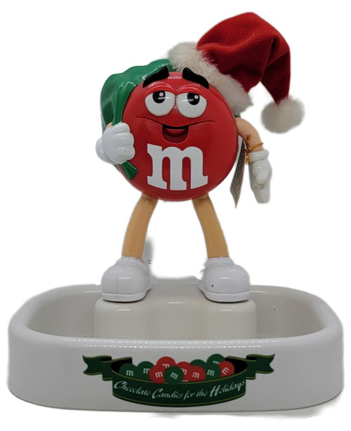 M&M's Talking Animated Christmas Candy Dish - Red M&M, festive red M&M character wearing Santa hat and holding a green candy cane.