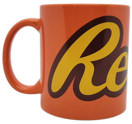 Galerie Reese's Peanut Butter Ceramic Coffee Mug, bright orange mug with bold yellow and black Reese's logo, classic cylindrical shape with a large handle for comfortable grip.