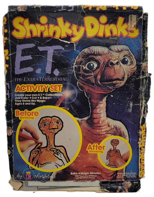 Colorforms 1982 Shrinky Dinks E.T. The Extra-Terrestrial activity set.  Create your own E.T. collectibles by coloring the picture and cut them out.  Then bake for 4 minutes and they shrink into a solid piece.  For ages 6 & up.