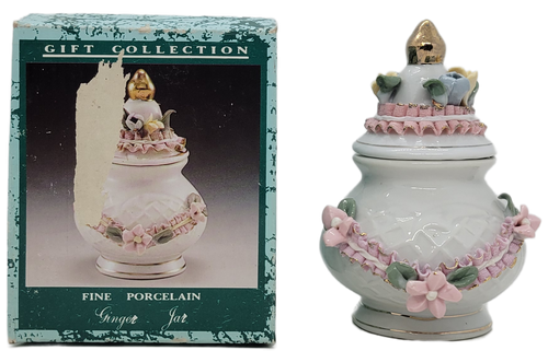 Vintage fine porcelain Capodimonte style Ginger jar by Gift Collections.  The Ginger jar is white with pink and yellow flowers and pink ribbon and gold trim.  The jar stands 4-inches tall.