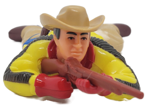 Plastic cowboy wind up toy with rifle that belly crawls.  The cowboy is 7-inches long wearing a yellow with brown stripes down arms shirt.  He also wears a brown hat, brown pants and brown shoes.  His holster for pistol is blue and the soles of his boots are blue.