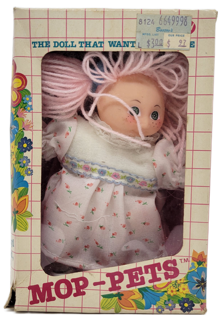 Fun World MOP-PETS 6-inch doll with pink hair.  The doll is made of soft vinyl with moveable head, arms & legs.  The dolls also have rooted hair and removable clothing.