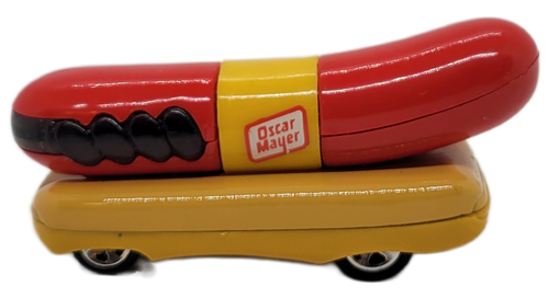 Hot Wheels 1993 Oscar Mayer hot dog Wienermobile 1:64 die-cast.  The advertising vehicle used by Oscar Mayer features a giant hot dog with Oscar Mayer on the sides riding on top of a yellow base.