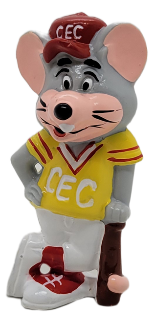 Showbiz Pizza Time 1986 PVC figure of Chuck E. Cheese wearing a baseball uniform.  The figure features Chuck E. Cheese wearing yellow jersey with red trim, white pants with red trim, red hat with CEC and red and white shoes while leaning on a bat.  Chuck E. Cheese figure stands 2.5-inches tall.
