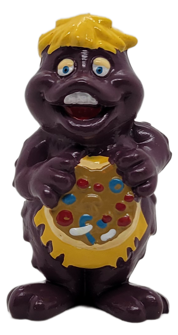 Showbiz Pizza Time 1983 PVC figure of Chuck E. Cheese's Mr. Munch.  Mr. Munch is a cross between a monster and an alien and is purple with yellow hair.  Mr. Munch figure stands 2.5-inches tall.