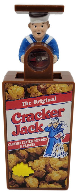 Cracker Jack Subway Kids Pak Toy 1999 Cracker Jack Series Cracker Jack Compass (Loose), toy figurine depicting a sailor boy with a compass atop a cereal box design.