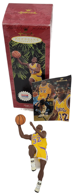 Hallmark Keepsake ornament 1997 Hoop Stars series Earvin Magic Johnson.  Magic Johnson is a Hall of Fame basketball player that played for the NBA's LA Lakers and is in a shooting position.  The ornament comes with an exclusive Classic trading card.