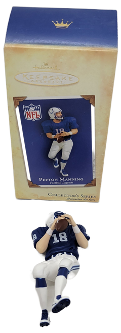 Hallmark Keepsake ornament 2004 football legends collector series of Peyton Manning.  Peyton Manning is a Hall of Fame Quarterback that played for the NFL's Indianapolis Colts and is in a drop back to throw position.