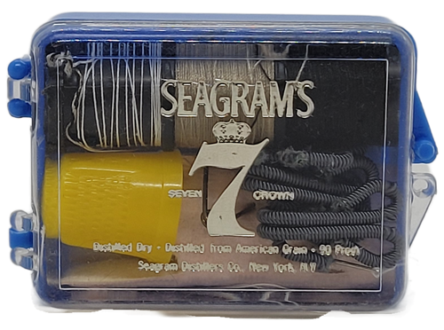 Seagram's 7 Crown promotional travel sewing kit with everything needed for minor repairs.  The kit contains threads, thimble, needles and other potential needs for quick repairs.