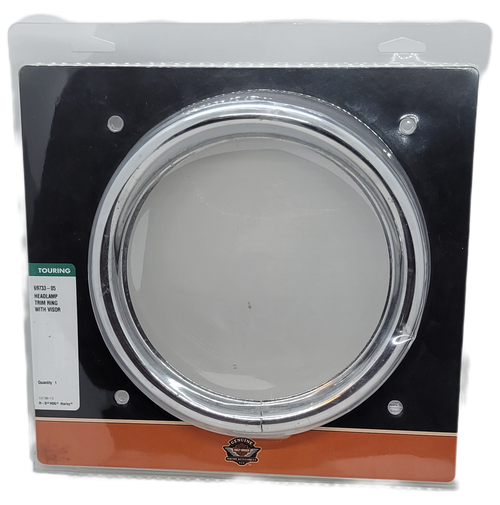 Harley-Davidson headlamp trim with visor #69733-05.  The headlamp trim fits '83 - later touring models (except tour glide and road glide), '94 - later FLHR models and '86 later FLST models with headlight Nacelle