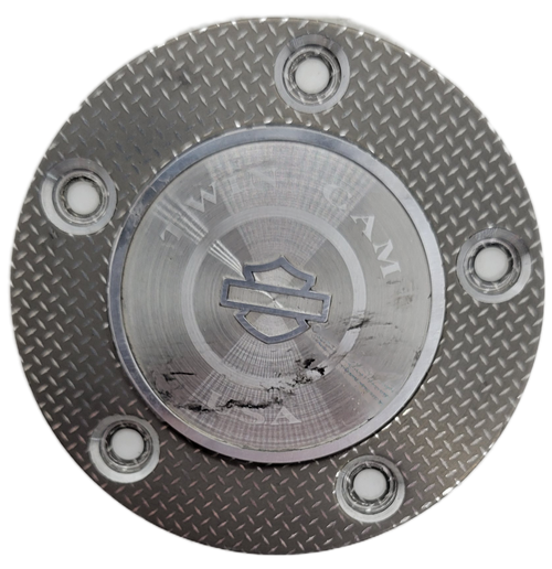 Harley-Davidson twin cam timing plate cover with diamond plate pattern.