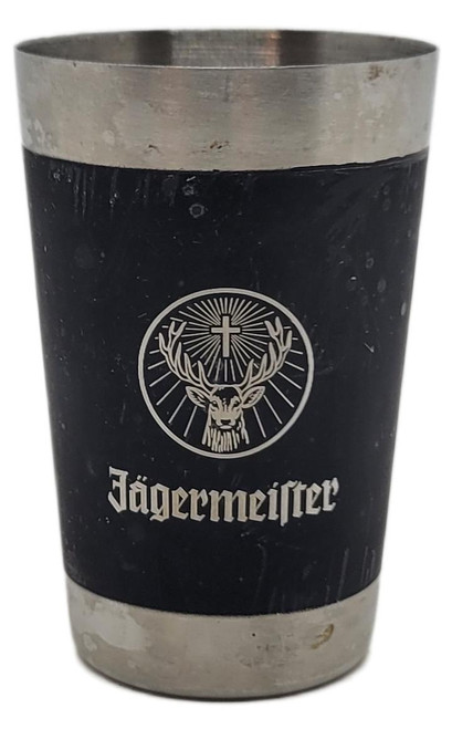 Jägermeister Stainless Steel Shot Glass Black Silver Logo, a durable shot glass featuring the Jägermeister branding with a black and silver color scheme and the iconic stag and cross logo.