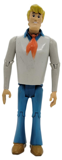 Product Character Options Ltd. Hanna-Barbera Scooby-Doo Fred Jones 5" Action Figure (Loose), standing pose with detailed facial features and classic outfit including white shirt, blue pants, orange neckerchief, and brown shoes.