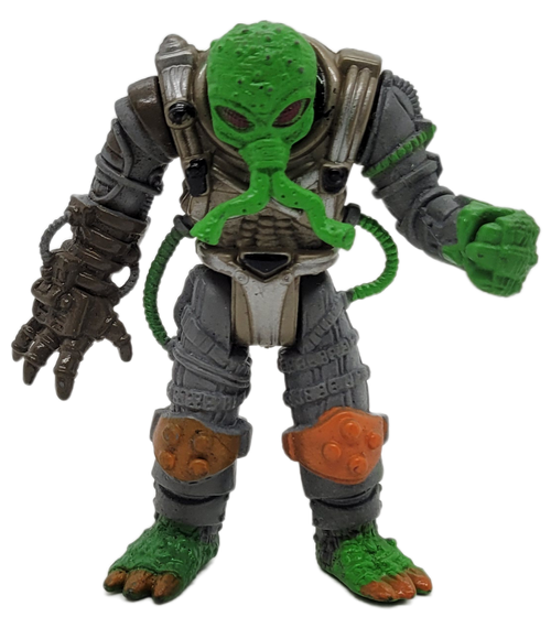 Space Quest Mission Squad 2001 Green Alien wearing space suit action figure by Chap Mei.  The alien stands 3.25-inches tall and is wearing a gray space suit with orange knee pads.