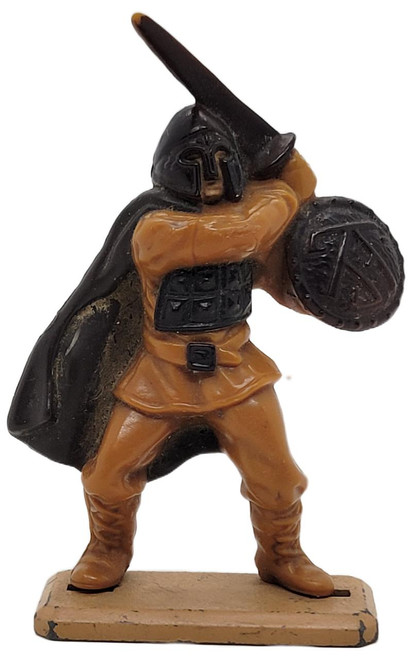 TONKA 1988 Willow: Rebel Trooper 3-inch figure (loose), detailed action figure depicting a Star Wars Rebel soldier in orange uniform holding a shield and weapon, with a black helmet and cape, on a beige base.