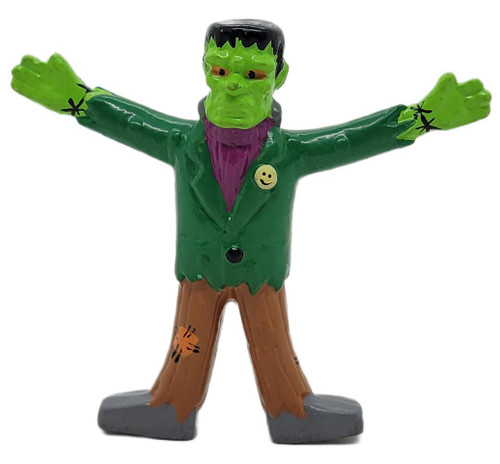 Applause Frankenstein 2.5" PVC Figure #55043, colorful toy figurine of Frankenstein with outstretched arms, green face, purple scarf, and brown pants.