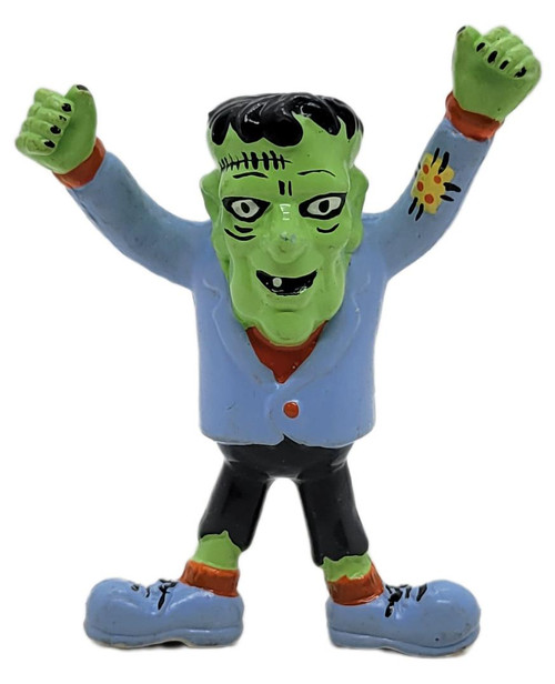 Applause 1989 Frankenstein 2.75" PVC Figure #21466, a colorful collectible toy depicting a cartoonish Frankenstein with a green face, black hair, blue jacket, black pants, large blue shoes, and arms raised in excitement.