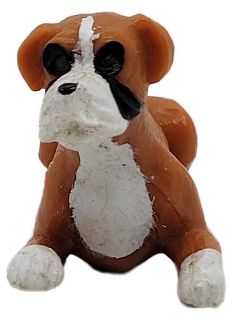 Vintage 1993 Puppy in my Pocket PVC figure of #7 Bruno / Cobra the boxer figure.  Bruno is brown with white paws, chest and face with black marks around eyes and cheeks.