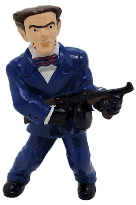 Dick Tracy's Flattop, played by William Forsythe 3-inch tall PVC figure. Caprice's top hitman. His most distinguishing feature is his square, flat cranium and matching haircut. He is wearing his blue suit, white shirt, red & black tie and holding his Tommy Gun.