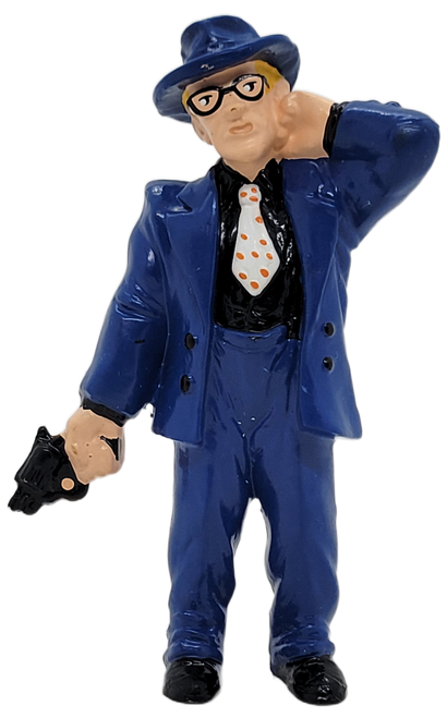 Dick Tracy's Itchy, played by Ed O'Ross 3.75-inch tall PVC figure. Itchy is Caprice's other hitman. He is usually paired with Flattop. He is wearing his blue suit, black shirt, white tie with pink polka dots. He is holding a pistol in his right hand.