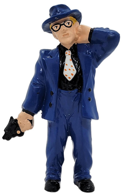 Applause 1990 Disney Dick Tracy Itchy 3.75-inch PVC figure, character dressed in a blue suit and hat, black shirt, polka dot tie, glasses, holding a gun, and striking a confident pose.