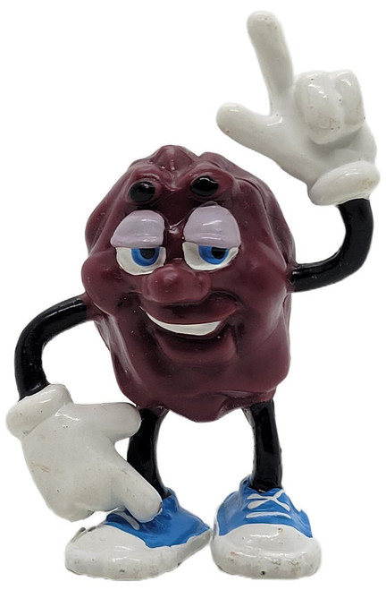 Applause California Raisins 1987 California Raisins Justine X. Grape Figure, a ceramic figurine of a grape character with a smiling face, wearing blue sneakers, and making a peace sign with one hand.