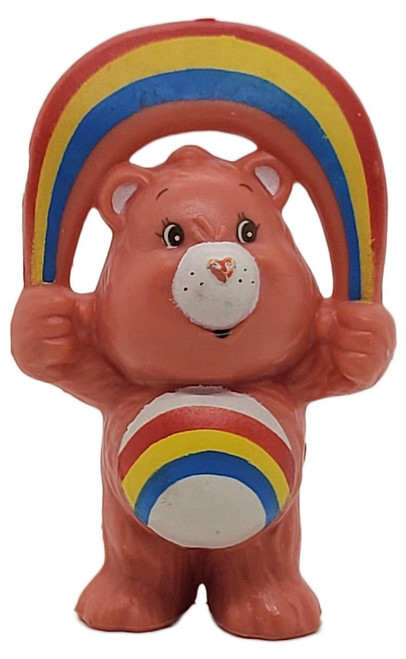 Care Bears A.G.C. 1983 Cheer Bear 2.5" PVC Figure, colorful plush bear toy holding a rainbow arch with a rainbow on its belly.