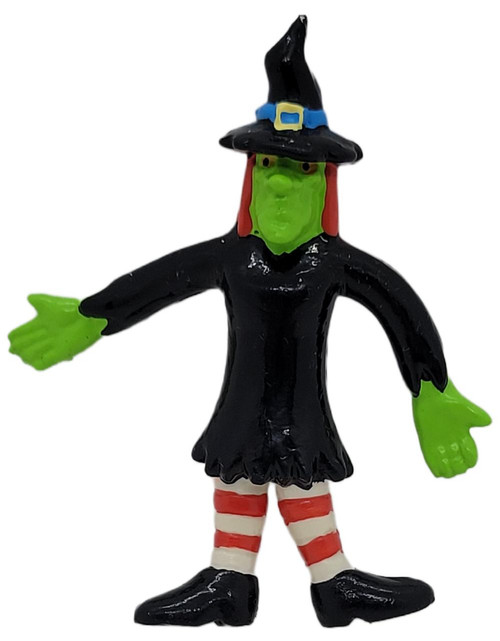 Applause Witch 2.75 inch PVC Figure, colorful witch character with green face, black dress, striped red and white socks, black shoes, and a traditional black pointed hat with a blue buckle.