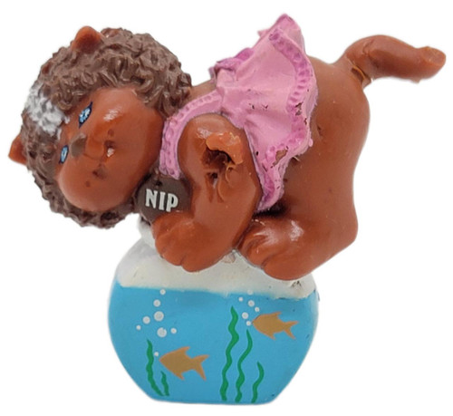 OAA 1985 Cabbage Patch Kids Koosas Cat With Fish Bowl Kip PVC Figure (Brown Cat), brown cat figurine with curly hair in pink dress sitting on a fishbowl with fish design.