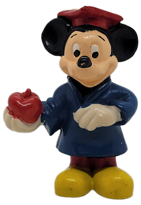 Walt Disney Productions Walt Disney Mickey Mouse Graduation With Apple 2.25-inch PVC figure made in Hong Kong, featuring Mickey Mouse in a graduation cap holding a red apple.