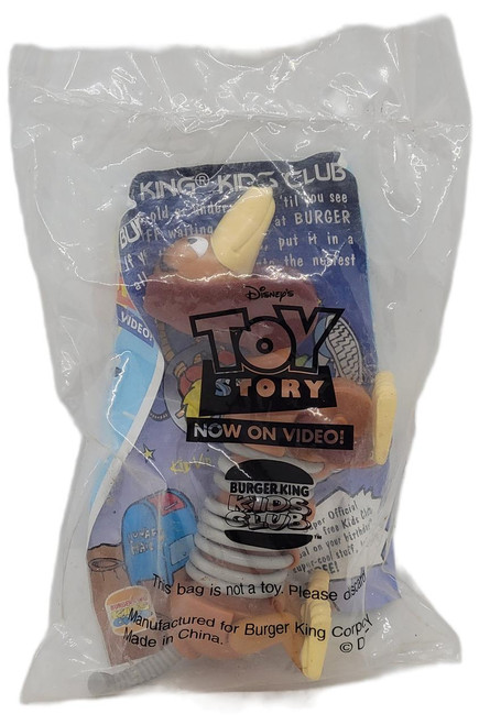 Burger King Kids Club 1996 Disney's Toy Story Slinky Dog Figure, small plastic toy of Slinky Dog from Toy Story inside original packaging.