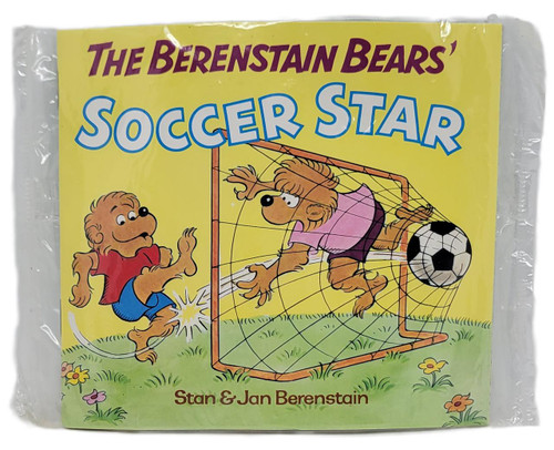 The Berenstain Bears' Soccer Star Mini-Storybook, vintage illustrated cover featuring lion cub goalie in pink shirt and purple shorts blocking a soccer ball from a bear cub player in red shirt and blue shorts on a grassy field with flowers.