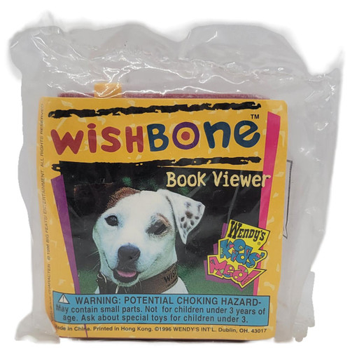 Wendy's Kids' Meal 1996 Wishbone Classic Tales Book Viewer - Oliver Twist, a small plastic toy in packaging with a picture of a dog and the Wendy's Kids Menu logo.