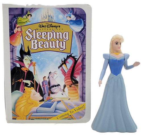 McDonald's Happy Meal Toy 1996 Disney Masterpiece Sleeping Beauty, plastic figurine of Princess Aurora in a blue gown next to the vintage packaging featuring characters from Sleeping Beauty.