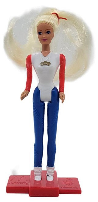 Product Barbie McDonald's Happy Meal Toy 1996 Barbie Dolls of the World #5 USA Barbie (Loose), front view of the collectible doll featuring blonde hair, a white and red top, blue pants, and a pink stand.