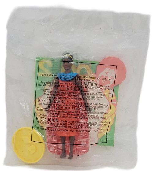 Product Barbie McDonald's Happy Meal Toy 1996 Barbie Dolls of the World #2 Kenyan Barbie, packaged in a clear plastic bag with a Barbie doll wearing a red and black outfit, a yellow accessory, and a colorful background.