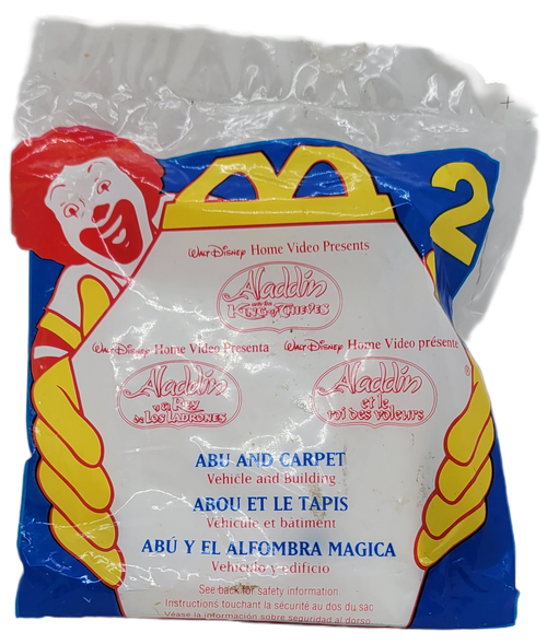 McDonald's Happy Meal toy of Abu and Carpet from the 1996 Disney Aladdin and the King of Thieves toys from August 16 - September 12, 1996.  Abu is riding on his magic carpet.