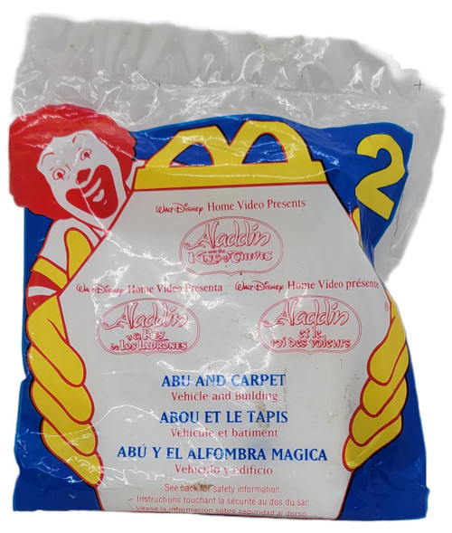McDonald's Happy Meal Toy 1996 Disney Aladdin King of Thieves #2 Abu and Carpet, plastic bag packaging with cartoon character image and product details in multiple languages.
