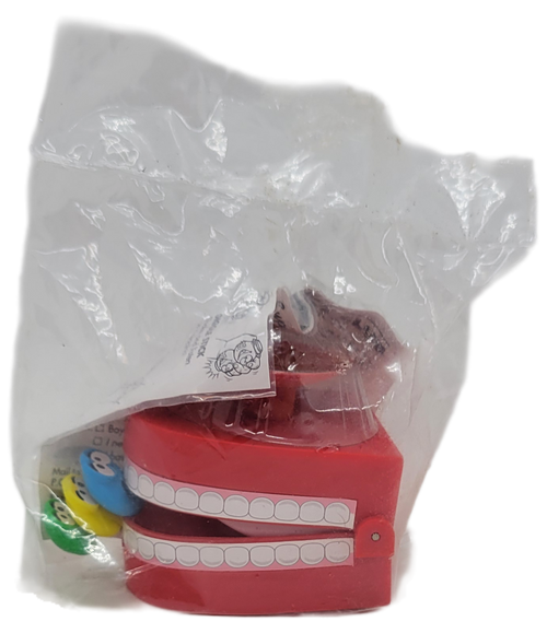 Burger King Kids' Club 1997 M&M's Minis Chomping Teeth Swarm.  The Chomping Teeth Swarm features a mouth with the blue, yellow and green M&M's in front of the teeth.  The series was available June 30 - August 31, 1997.