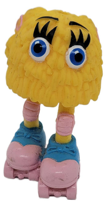 McDonald's Happy Meal Toy 1989, Funny Fry Friends #2 Rollin' Rocker, loose with no headphones, featuring a yellow, fluffy character with big blue eyes, pink shoes, and roller skate wheels.